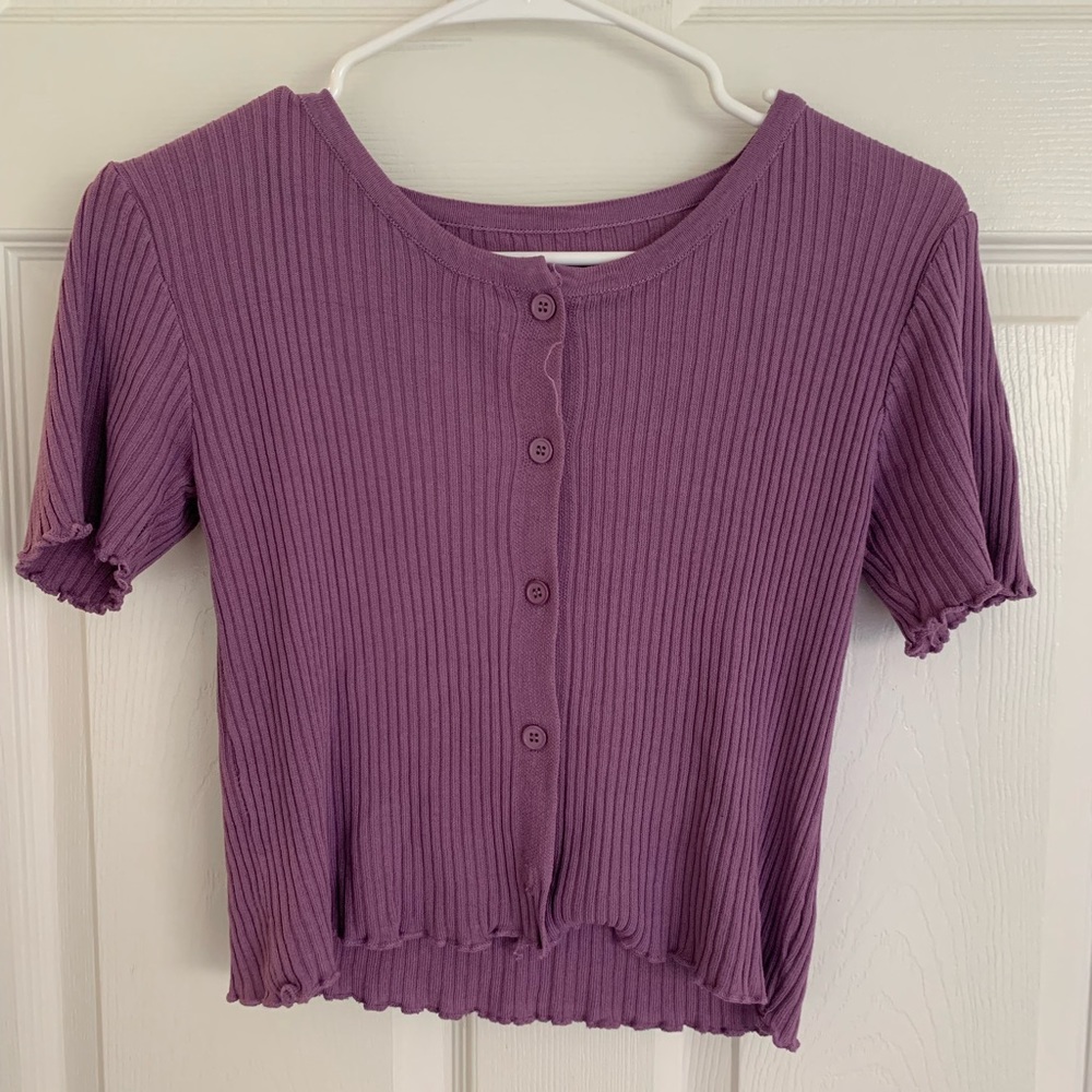 Purple loose fit button up crop top in the color purple.
